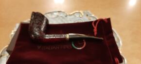Italian pipe made by Vincenzo features Red sandblast finish with a smoky Brownish stem. Fairly large smoking bowl